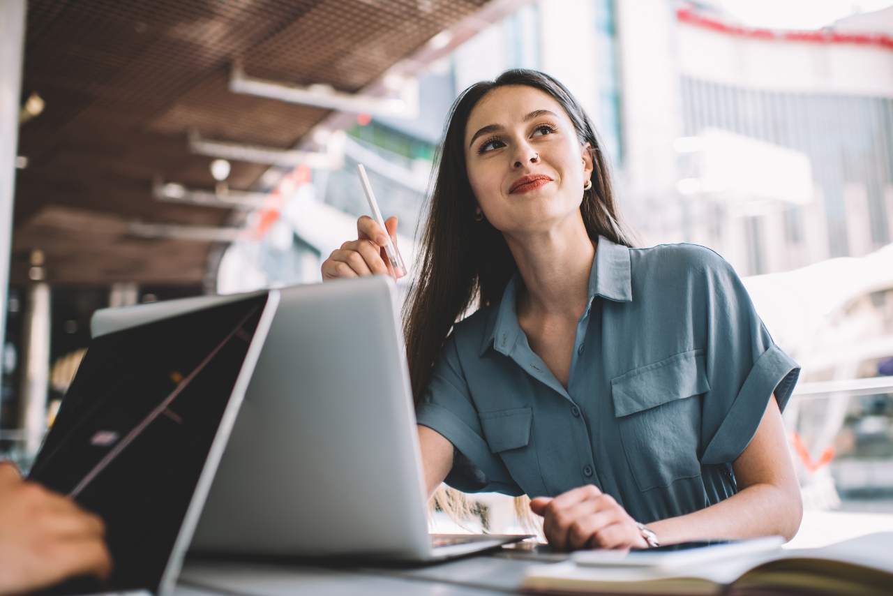 Best freelance websites: Happy writer smiling at work